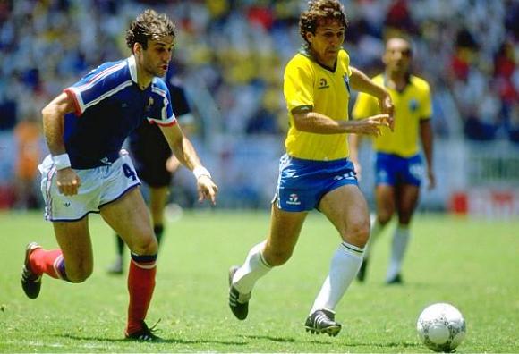 21 Jun 1986: Zico (right) of Brazil takes on Batiston of France during the World Cup quarter-final at the Jalisco Stadium in Guadalajara, Mexico. France won 4-3 on penalties. Mandatory Credit: David Cannon/Allsport